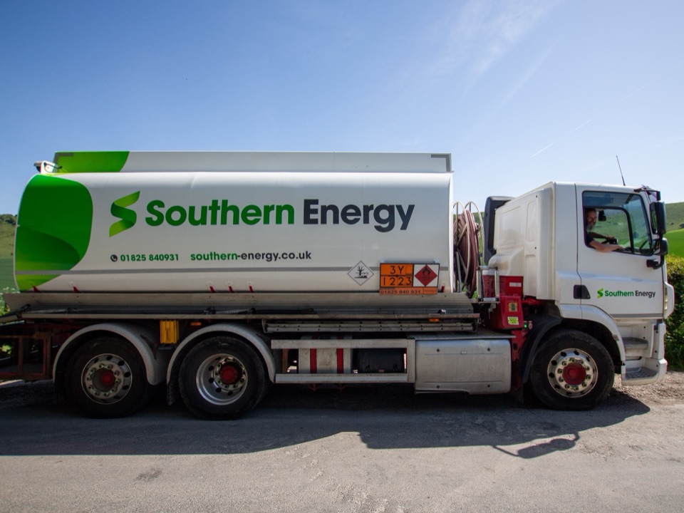A Southern Energy tanker parked on a country lane, its driver smiling from the cab